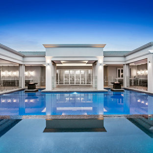 Design ideas for a large contemporary courtyard custom-shaped pool in Melbourne with a hot tub and concrete pavers.