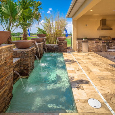 Pool fountain - small transitional backyard tile and rectangular pool fountain idea in Orlando