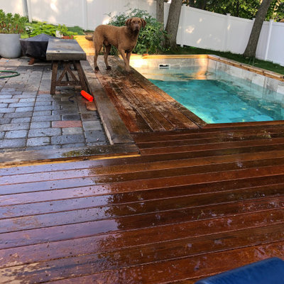 Small trendy backyard rectangular natural hot tub photo in Boston with decking