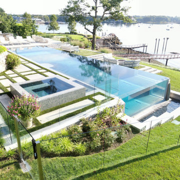 vanishing edge glass wall pool + raised perimeter overflow spa