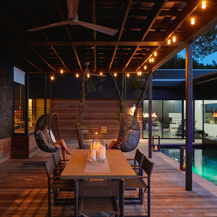 Idee per una piscina design a "L" in cortile con pedane