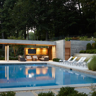 Inspiration for a mid-sized modern backyard rectangular pool house remodel in New York