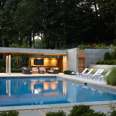 Inspiration for a mid-sized modern backyard rectangular pool house remodel in New York