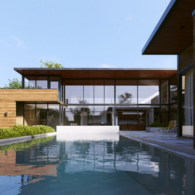Inspiration for a large contemporary backyard concrete and rectangular infinity pool fountain remodel in Dallas