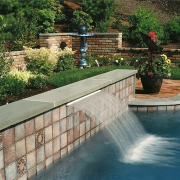 Water Feature On Gunite Pool with Custom Tile and Bluestone Wall Cap