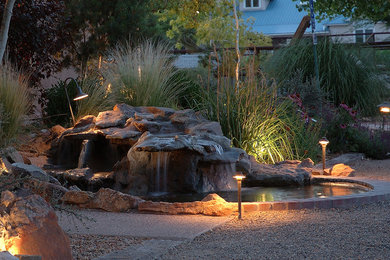 Inspiration for a mid-sized timeless backyard stone natural hot tub remodel in Albuquerque