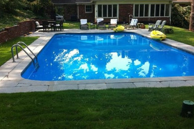 Example of a backyard stone and rectangular pool design in Atlanta