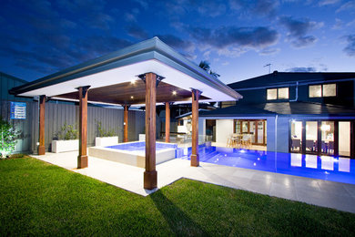 Design ideas for a medium sized modern swimming pool in Brisbane.