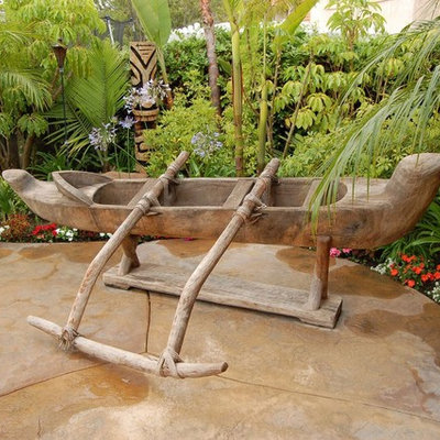 Mid-sized island style backyard concrete and custom-shaped natural hot tub photo in Denver