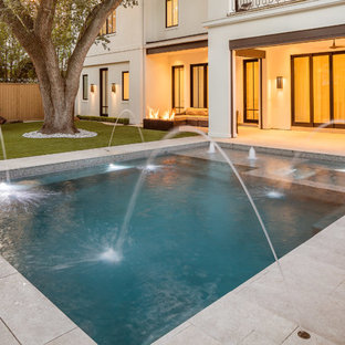 Small contemporary backyard rectangular pool in Houston with a hot tub and tile.