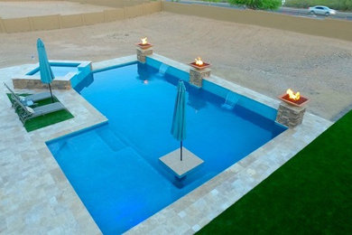 Inspiration for a contemporary backyard stone and l-shaped hot tub remodel in Phoenix