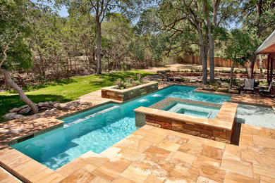 Hot tub - large contemporary backyard custom-shaped lap hot tub idea in Austin