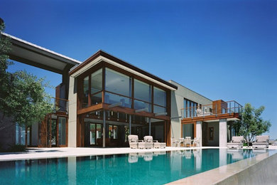 Inspiration för en funkis rektangulär pool på baksidan av huset