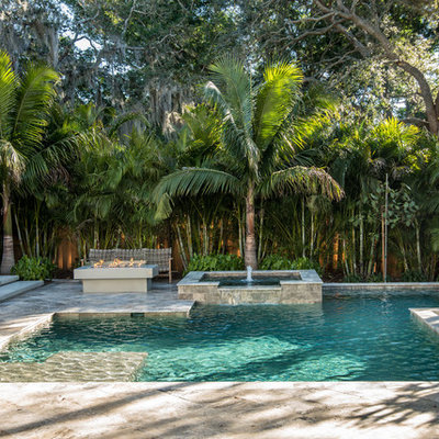 Inspiration for a contemporary backyard tile and custom-shaped pool fountain remodel in Tampa
