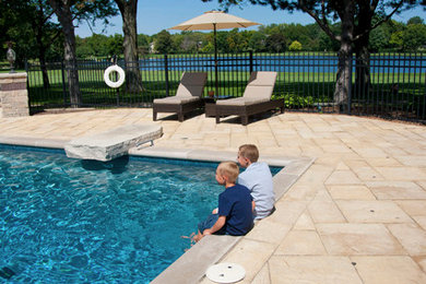 Inspiration for a timeless backyard concrete paver pool remodel in Chicago