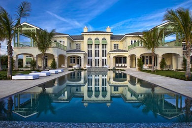 Huge island style backyard rectangular and concrete lap hot tub photo in Miami