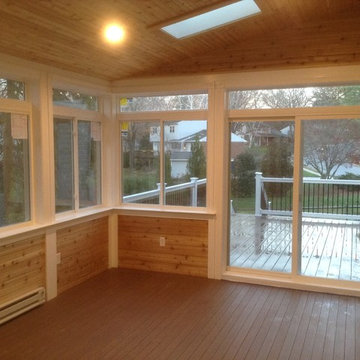 3-Season Room with exterior deck. Stamped Concrete & Retaining Wall