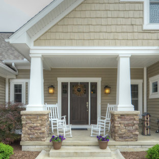 Idee per un portico stile americano di medie dimensioni e davanti casa con lastre di cemento