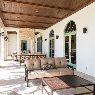 Island style porch photo in Other with a roof extension