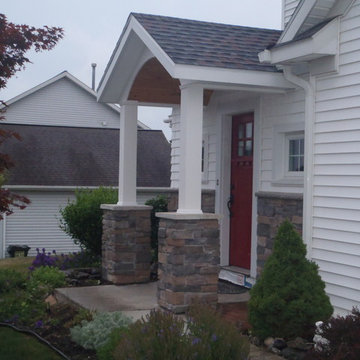 Addition with door canopy and stone work
