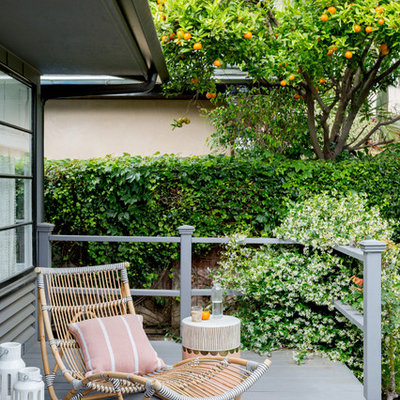 Trendy back porch idea in Los Angeles with decking and a roof extension