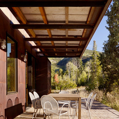 Farmhouse porch idea in Salt Lake City with decking and a roof extension