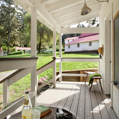 Country porch idea in San Francisco with decking and a roof extension