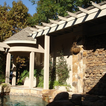 BAY OAKS PATIO COVER WITH ROCK WALL WATER FALL