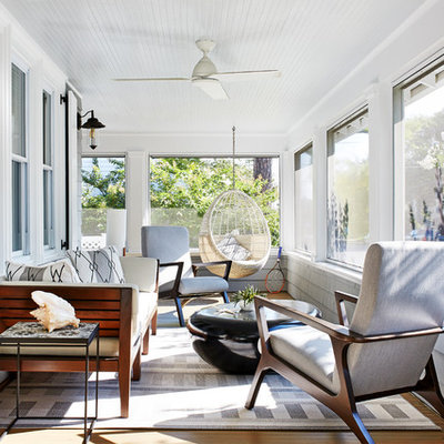 Inspiration for a coastal front porch remodel in Other with a roof extension