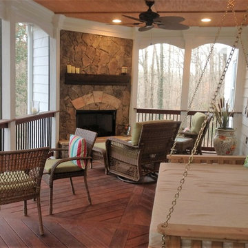 Beautiful Back Porch with Stone Fireplace and Swing