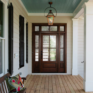 Foto di un portico bohémian di medie dimensioni e davanti casa con pedane e un tetto a sbalzo