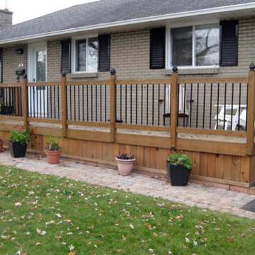 Cedar with iron porch and fence