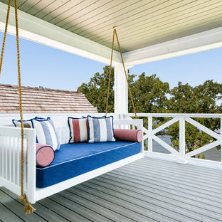 Transitional porch idea in Dallas with decking and a roof extension