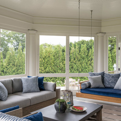 Beach style tile screened-in porch photo in New York with a roof extension