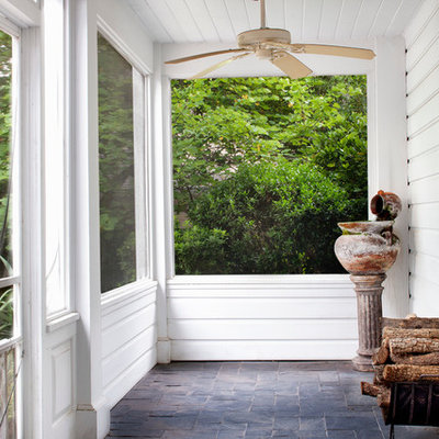 This is an example of a traditional porch design in Austin with a roof extension.