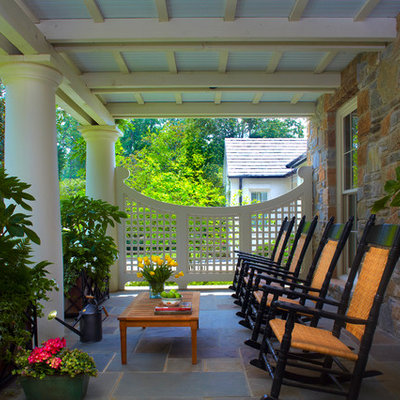 Elegant porch photo in Atlanta with a roof extension