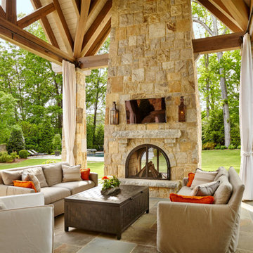 Covered Patio with Soaring Stone Fireplace