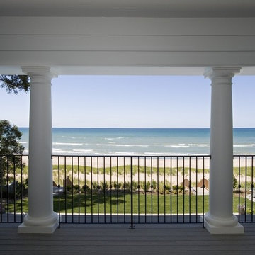 Covered Porch with Round Columns and Iron Rail System