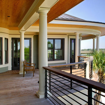 Curved porches capture the view of the Folly River