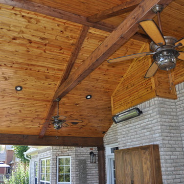 Custom open gable porch with tongue and groove ceiling and cedar posts