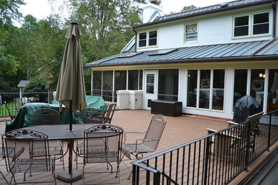 Inspiration for a large timeless porch remodel in Charlotte with decking