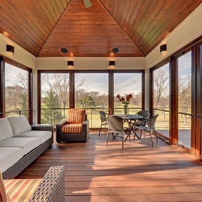 Farmhouse porch idea in Minneapolis with decking and a roof extension