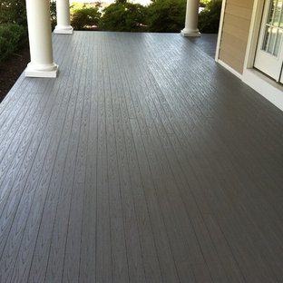 Inspiration for a large modern front porch remodel in Other with decking and a roof extension