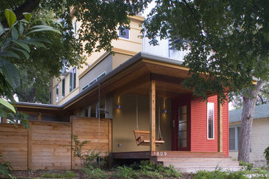 Small minimalist front porch idea in Austin with decking and a roof extension