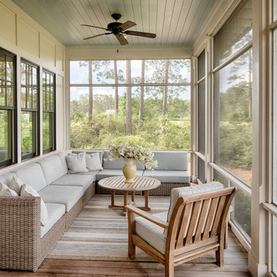 Inspiration for a coastal screened-in back porch remodel in Atlanta with decking and a roof extension