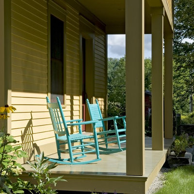 Farmhouse porch photo in Burlington with a roof extension