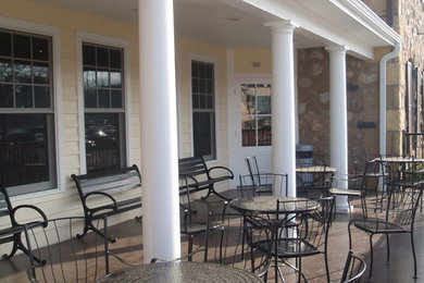 Farmhouse concrete porch idea in Milwaukee