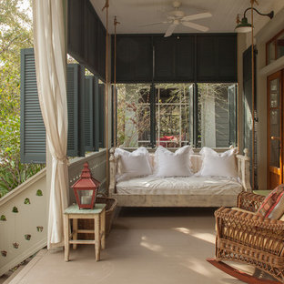Cottage chic porch photo in Miami with a roof extension
