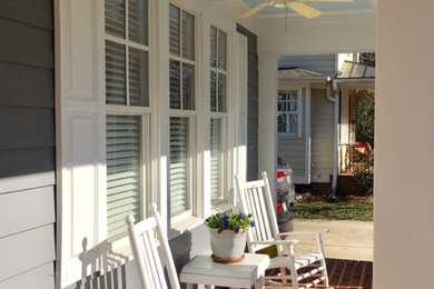 Inspiration for a mid-sized timeless front porch remodel in Raleigh