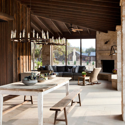 Farmhouse porch idea in Austin with a roof extension